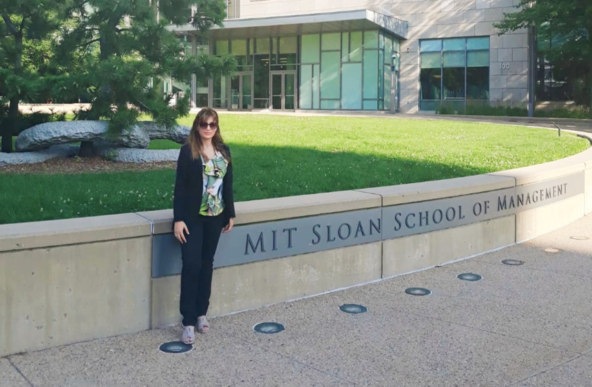 Angelica in front of MIT Sloan School of Management in Cambridge Massachusetts